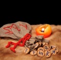 Runes, pouch and candle with copy space Royalty Free Stock Photo