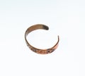 Runic engraved copper wrist bracelet. Copper jewelry Royalty Free Stock Photo