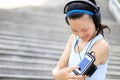 Runner athlete listening to music in headphones fr Royalty Free Stock Photo