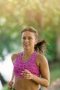 Runner athlete running at park. woman fitness jogging workout wellness concept. Royalty Free Stock Photo