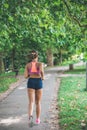 Runner athlete running at park. woman fitness jogging workout wellness concept. Royalty Free Stock Photo