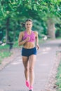 Runner athlete running at park. woman fitness jogging workout wellness concept. Royalty Free Stock Photo