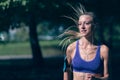 Runner athlete running at park. woman fitness jogging workout wellness concept.