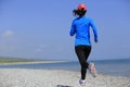 Runner athlete running on seaside of qinghai lake Royalty Free Stock Photo