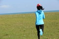 Runner athlete running on seaside of qinghai lake Royalty Free Stock Photo