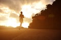 Runner athlete running at seaside road