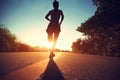 Runner athlete running at seaside road