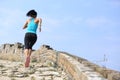 Runner athlete running on trail at chinese great wall Royalty Free Stock Photo