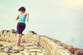 Runner athlete running on trail at chinese great wall Royalty Free Stock Photo