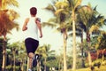 Runner athlete running at tropical park Royalty Free Stock Photo