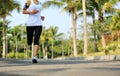 Runner athlete running at tropical park Royalty Free Stock Photo