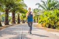 Runner athlete running at tropical park. woman fitness sunrise jogging workout wellness concept Royalty Free Stock Photo