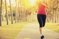 Runner athlete running at tropical park. woman fitness sunrise jogging workout Royalty Free Stock Photo