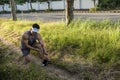 A runner bends down and stretches his calf to alleviate the pain caused by cramping. Common running injury Royalty Free Stock Photo