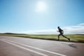 Runner blur, fast and man on road outdoor, cardio or healthy body fitness. Athlete speed, sprint or exercise in