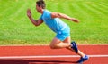 Runner captured in motion just after start of race. Runner sprint race at stadium. Boost speed concept. Man athlete Royalty Free Stock Photo