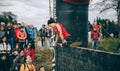 Runner climbing wall in a test of extreme obstacle race