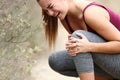 Runner complaining with knee ache after running Royalty Free Stock Photo