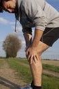 Runner with cramp Royalty Free Stock Photo