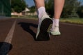 Runner feet running on the road close-up on shoes. Royalty Free Stock Photo