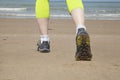 Runner feet on the sand beach Royalty Free Stock Photo