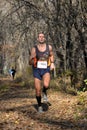 runner in a forest amateur marathon the city park of dnepropetrovsk city november Royalty Free Stock Photo