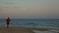 Runner on Full Moon at Long Island Beach