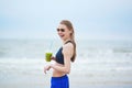 Runner girl drinking green vegetable smoothie Royalty Free Stock Photo