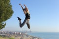 Runner with headphones jumping celebrating success Royalty Free Stock Photo