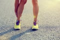 Runner holding her injured leg on road Royalty Free Stock Photo