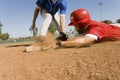Runner And Infielder Reaching Base Royalty Free Stock Photo