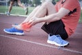 Runner with injured ankle on the track Royalty Free Stock Photo