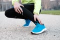 Runner with injured ankle while training in the city park in col Royalty Free Stock Photo