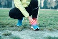 Runner with injured ankle while training Royalty Free Stock Photo