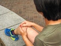 Runner with injured knee on the track Royalty Free Stock Photo