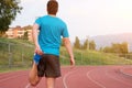 Runner with injured knee on the track Royalty Free Stock Photo