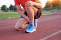 Runner with injured knee on the track Royalty Free Stock Photo