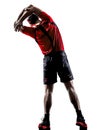 Runner jogger stretching warming up silhouette Royalty Free Stock Photo