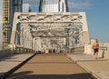 Runner on John Seigenthaler pedestrian bridge or Shelby street crossing at sunrise in Nashville Royalty Free Stock Photo