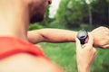 Runner looking checking sport watch Royalty Free Stock Photo