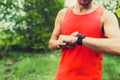 Runner looking at sport watch smartwatch Royalty Free Stock Photo