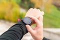 Runner man checking stopwatch. Hands detail. Unrecognizable.