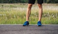 Runner man feet running on road closeup on shoe. Sports healthy lifestyle concept Royalty Free Stock Photo