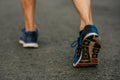Runner man feet running on road closeup on shoe. Sports healthy lifestyle concept Royalty Free Stock Photo