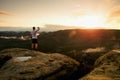 Runner man in his target with hand in the air. Sweaty man in black pants and white sweaty t-shirt, Royalty Free Stock Photo