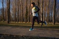 Runner joggin in the park in the winter Royalty Free Stock Photo