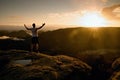 Runner on the peak. Man in his target gesture triumph with hands in the air. Crazy man in black pants and white cotton t-shirt, Royalty Free Stock Photo