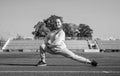 runner prepare for race competition. sprinter warming up on stadium gym. flexibility. child training at school physical Royalty Free Stock Photo