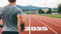 Runner prepares at starting line of outdoor track, focused on 2025 Royalty Free Stock Photo