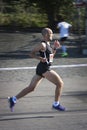 A runner in profile. Motion blur to emphasize the speed.